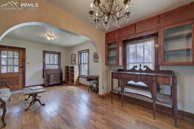 a view of a livingroom with furniture and a window