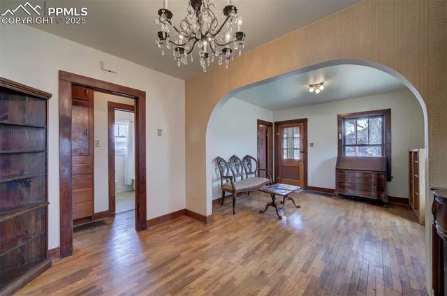 a view of a livingroom with furniture and a workspace