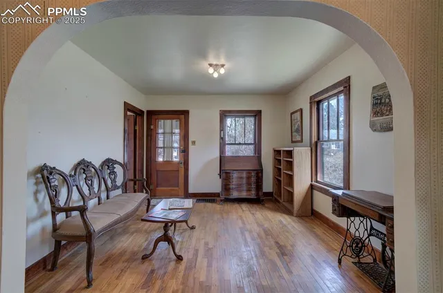 a view of a livingroom with furniture and a window