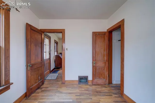 a view of hallway with wooden floor
