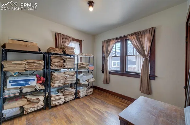 a bedroom with bunk bed and a window