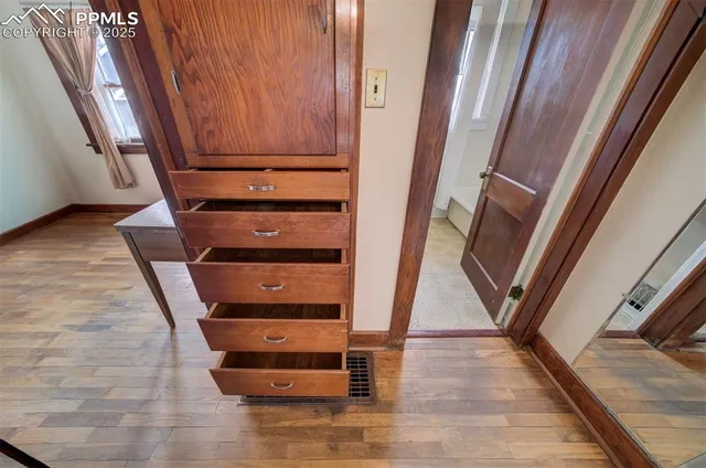 a view of staircase with a chair