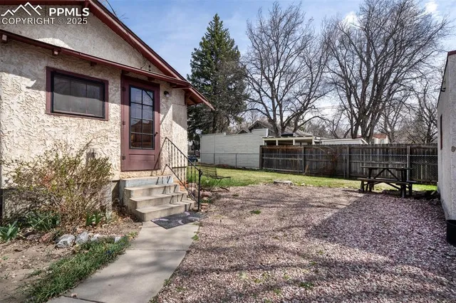 a backyard of a house with seating space