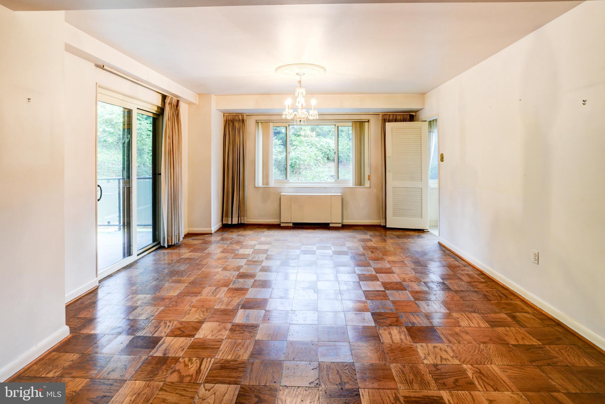 4201 Cathedral Avenue Northwest, Unit 201E Washington, DC 20016 - Photo 14 of 66 a view of empty room with windows