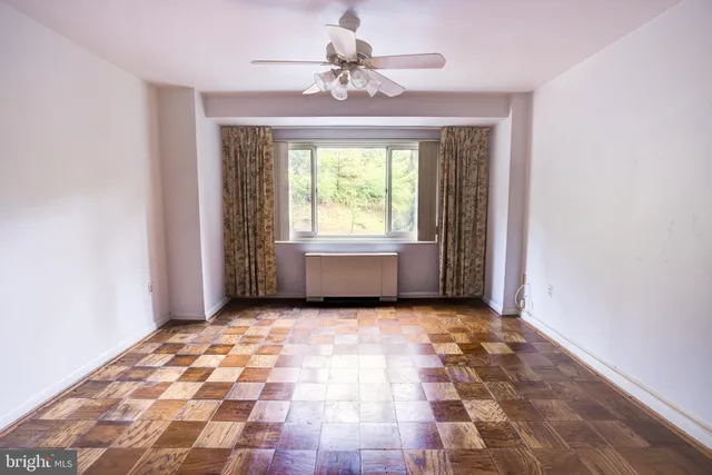 an aerial view of residential house with outdoor space and trees all around