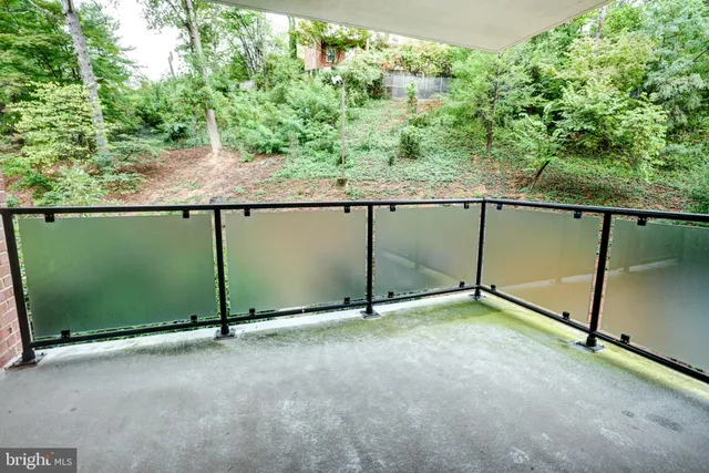 a view of a house with wooden fence