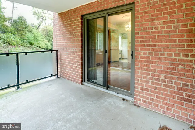 a view of a room with furniture and window
