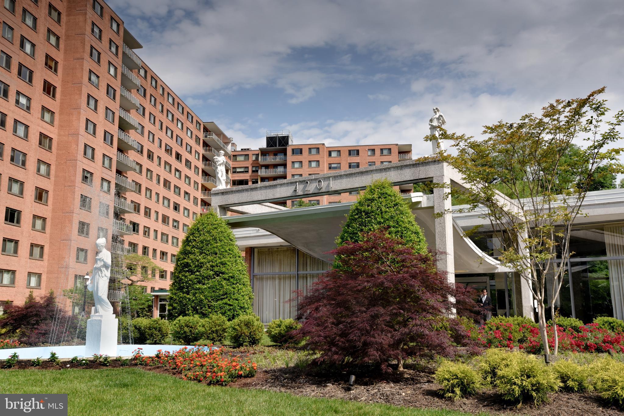 4201 Cathedral Avenue Northwest, Unit 201E Washington, DC 20016 - Photo 52 of 66 front view of a building with a garden