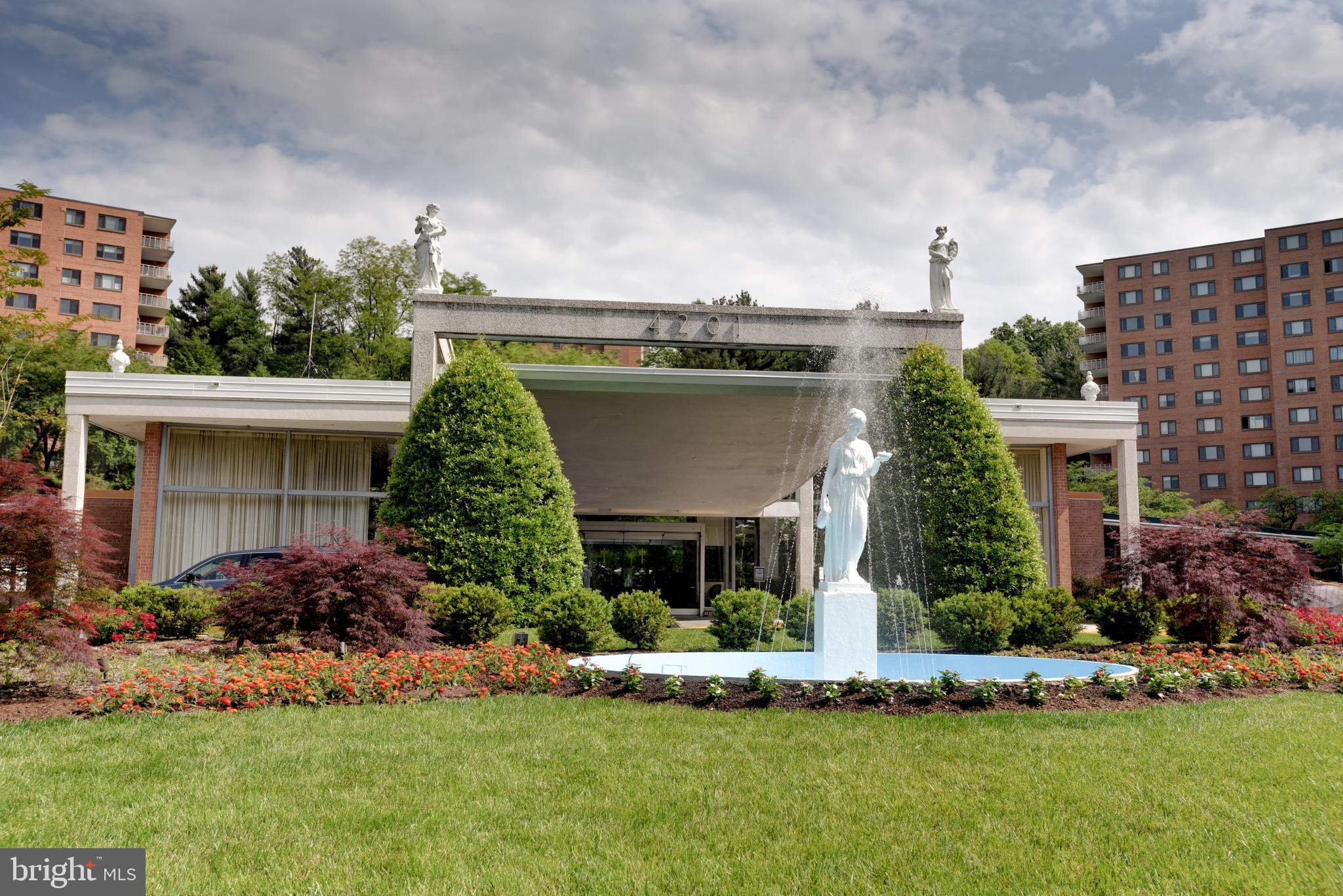 4201 Cathedral Avenue Northwest, Unit 201E Washington, DC 20016 - Photo 53 of 66 a front view of house with a garden