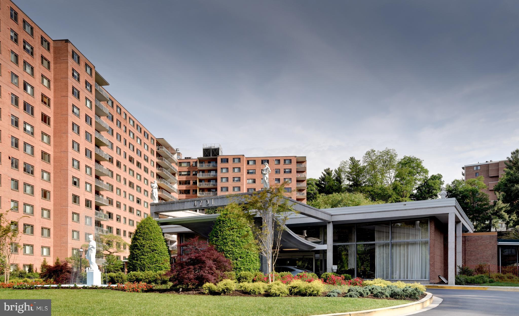 4201 Cathedral Avenue Northwest, Unit 201E Washington, DC 20016 - Photo 65 of 66 front view of a building with a garden