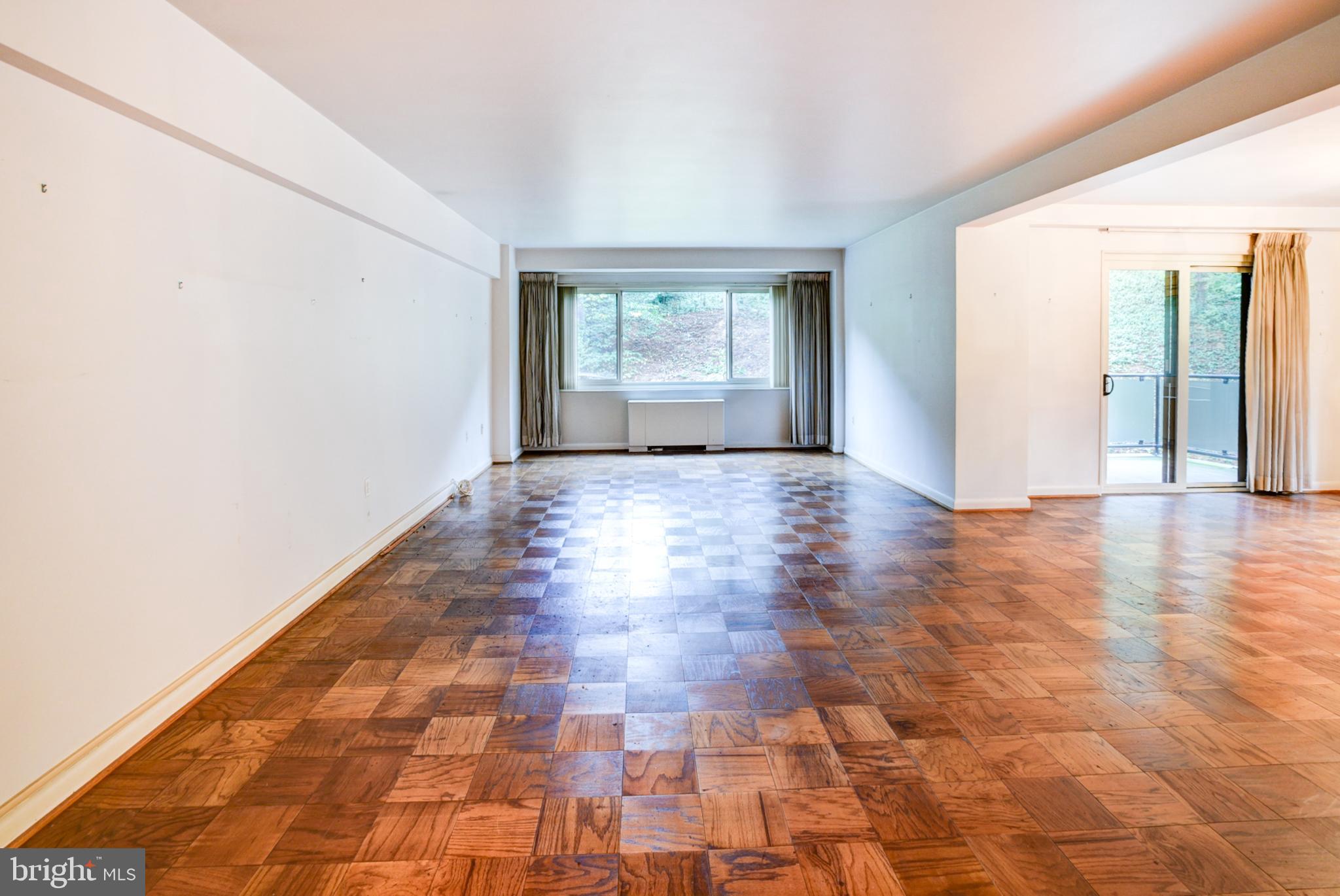 4201 Cathedral Avenue Northwest, Unit 201E Washington, DC 20016 - Photo 7 of 66 a view of an empty room with window