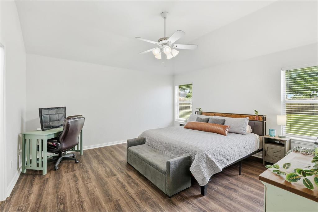 217 Seay Road Italy, TX 76651 - Photo 17 of 38 Bedroom featuring dark wood-style floors, ceiling fan, lofted ceiling, and an office area