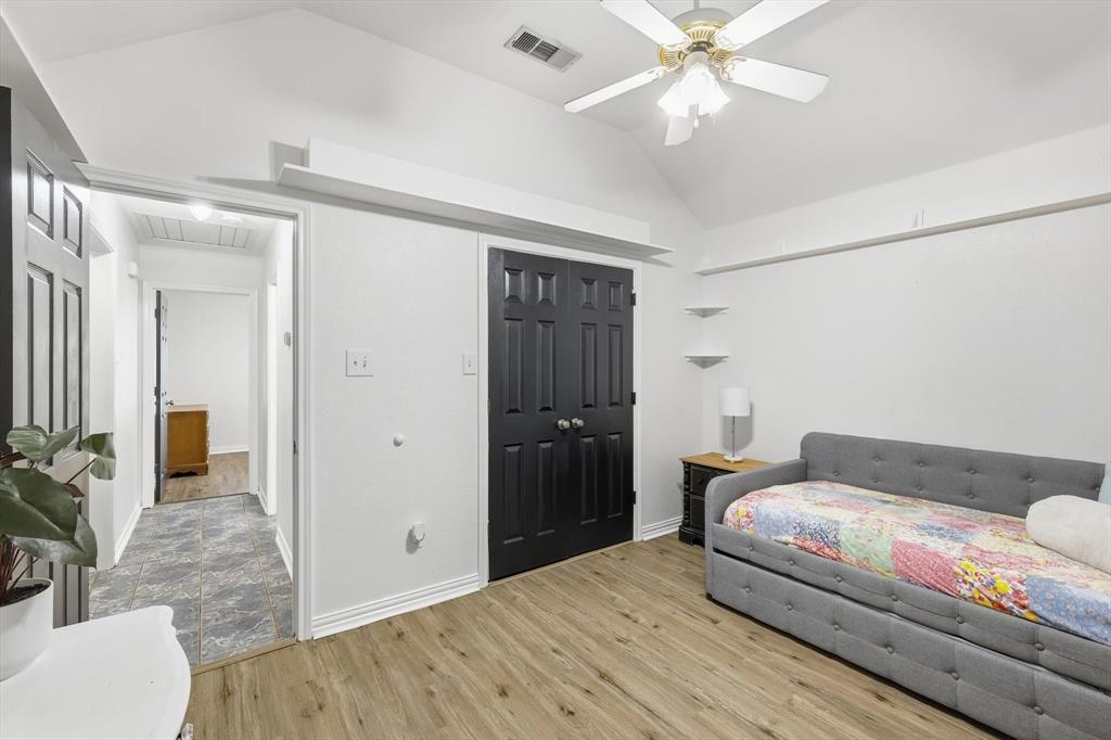 217 Seay Road Italy, TX 76651 - Photo 18 of 38 Bedroom with vaulted ceiling, light wood-style floors, a closet, and ceiling fan