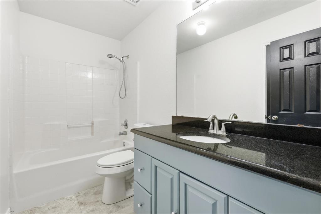 217 Seay Road Italy, TX 76651 - Photo 26 of 38 Full bath featuring vanity and shower / tub combination