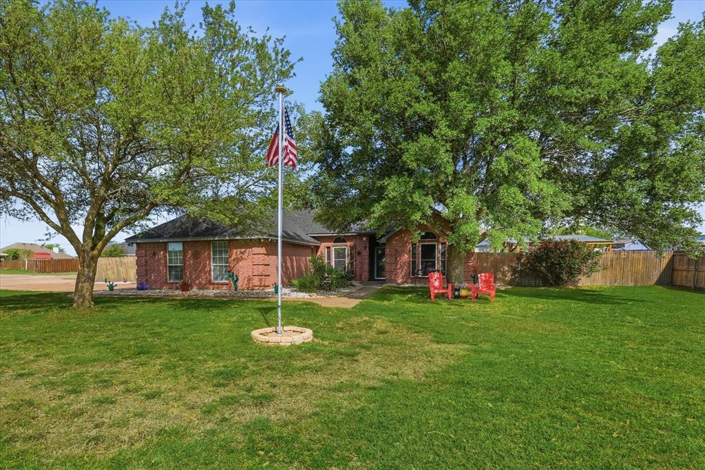 217 Seay Road Italy, TX 76651 - Photo 3 of 38 iew of property featuring beautiful trees.