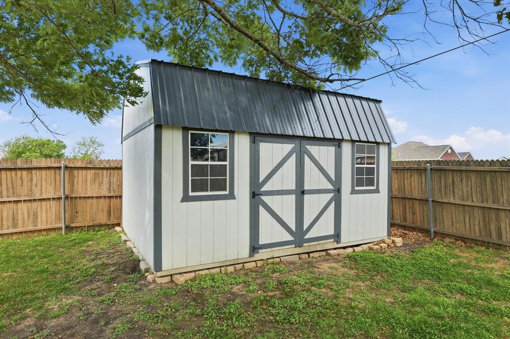 217 Seay Road Italy, TX 76651 - Photo 32 of 38 View of shed featuring a fenced backyard