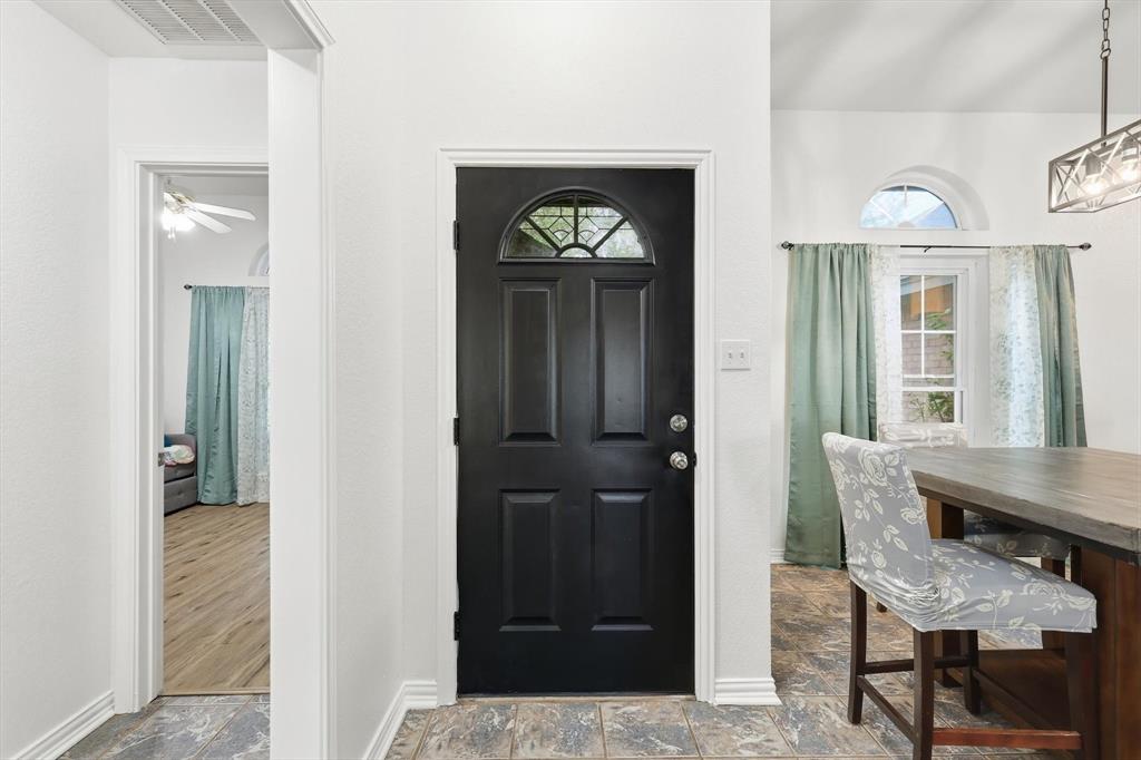 217 Seay Road Italy, TX 76651 - Photo 4 of 38 Entrance foyer featuring stone finish floors and ceiling fan