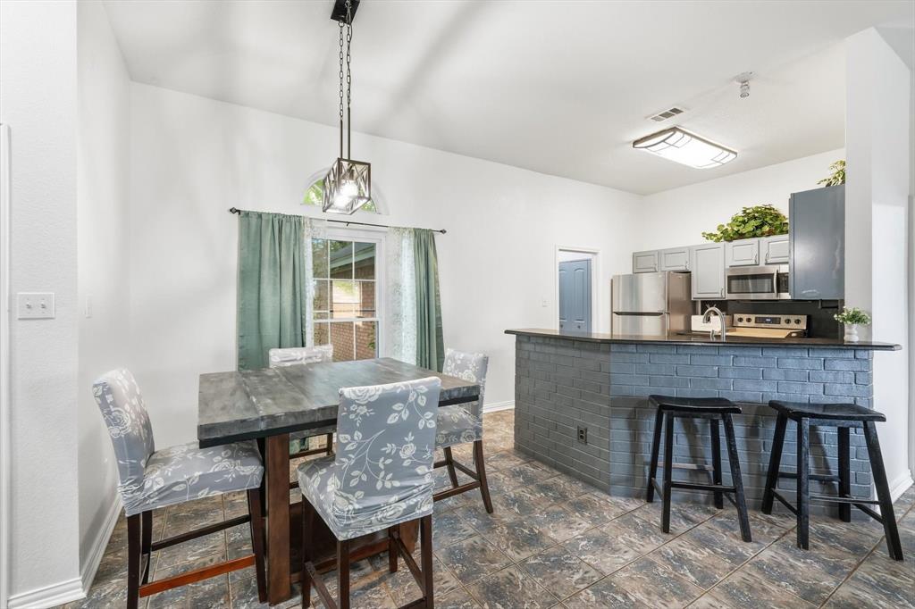 217 Seay Road Italy, TX 76651 - Photo 9 of 38 Dining room open to kitchen and dining