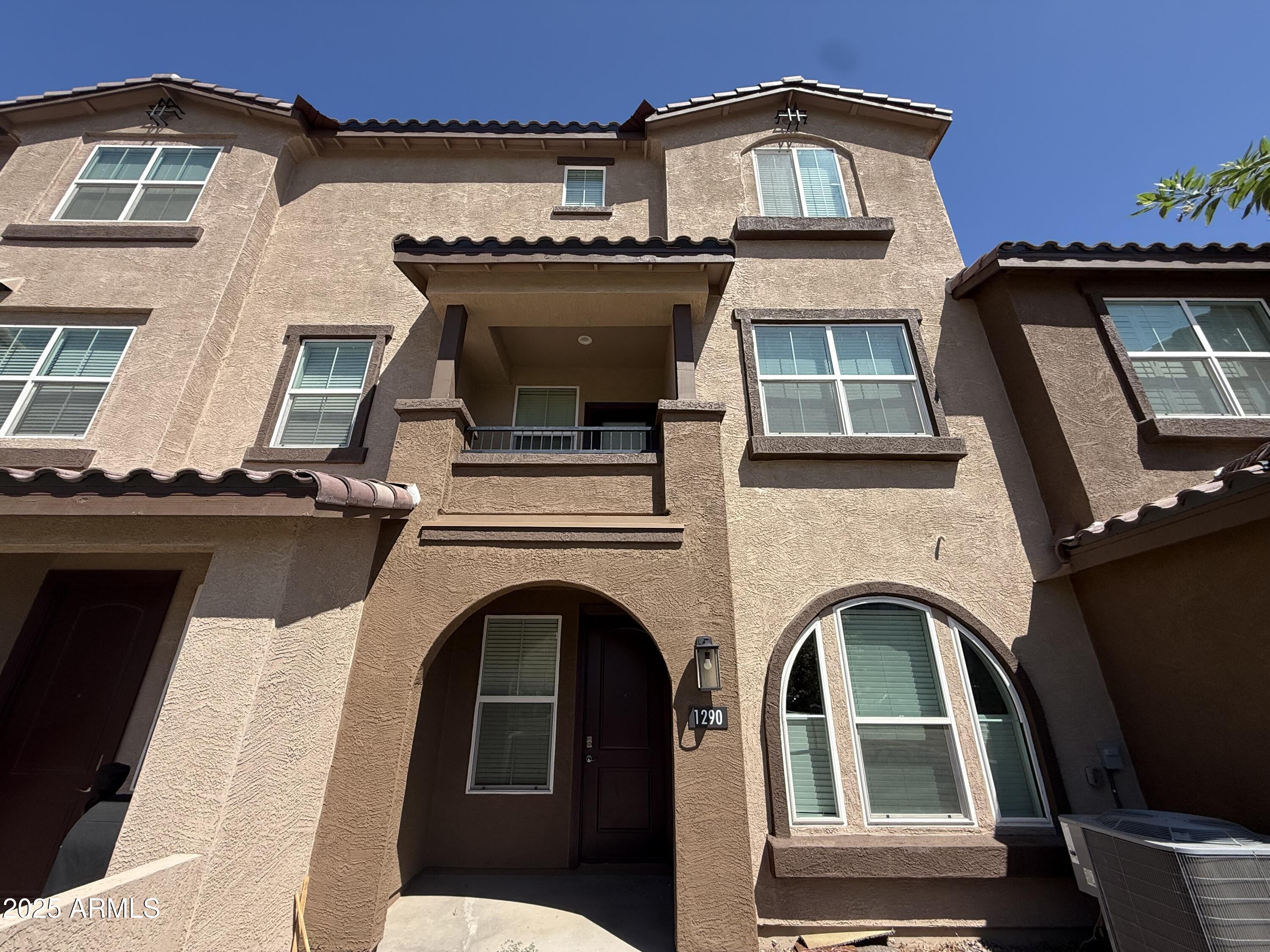 1255 North Arizona Avenue, Unit 1290 Chandler, AZ 85225 - Photo 1 of 13 a view of a building with a balcony