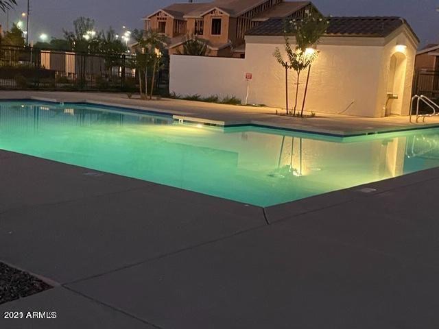 1255 North Arizona Avenue, Unit 1290 Chandler, AZ 85225 - Photo 4 of 13 a view of a house with a swimming pool