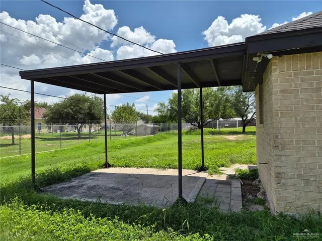 a view of a house with backyard from a porch
