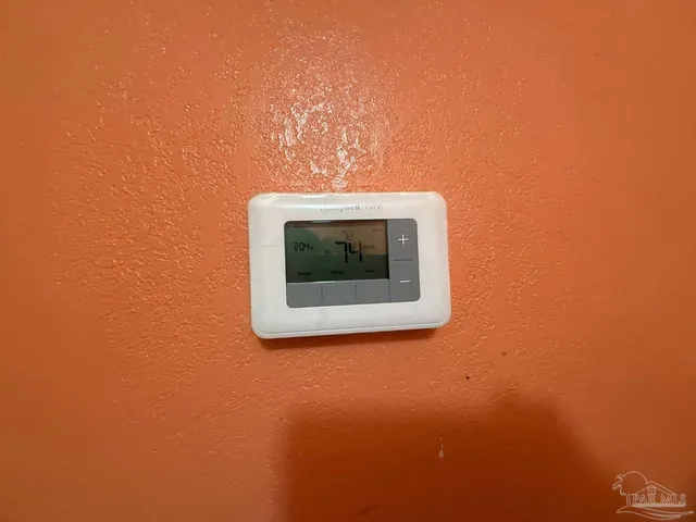 a kitchen with granite countertop a sink a stove and refrigerator