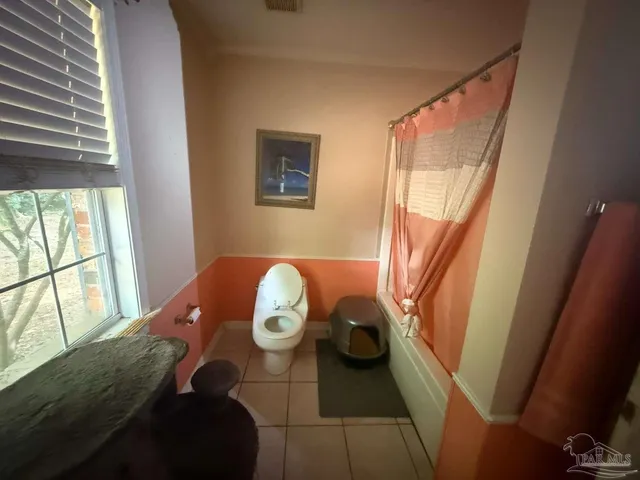 a living room with lots of furniture and a fireplace