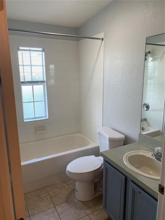3001 Laurel Run Lane, Unit 301 Kissimmee, FL 34741 - Photo 17 of 17 a bathroom with a sink toilet and shower