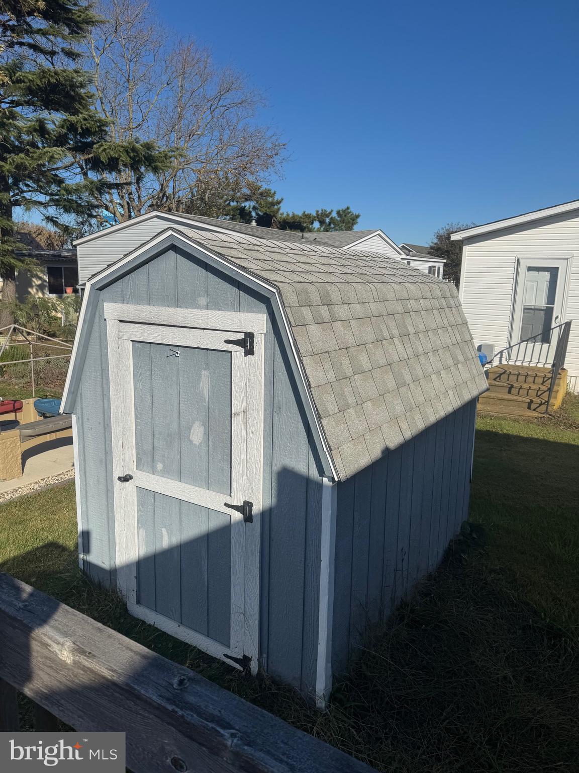 13318 Colonial Road Ocean City, MD 21842 - Photo 13 of 13 a front view of a house with wooden fence
