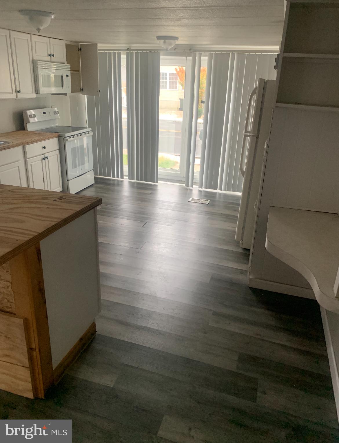 13318 Colonial Road Ocean City, MD 21842 - Photo 3 of 13 a kitchen with stainless steel appliances granite countertop a refrigerator and a stove