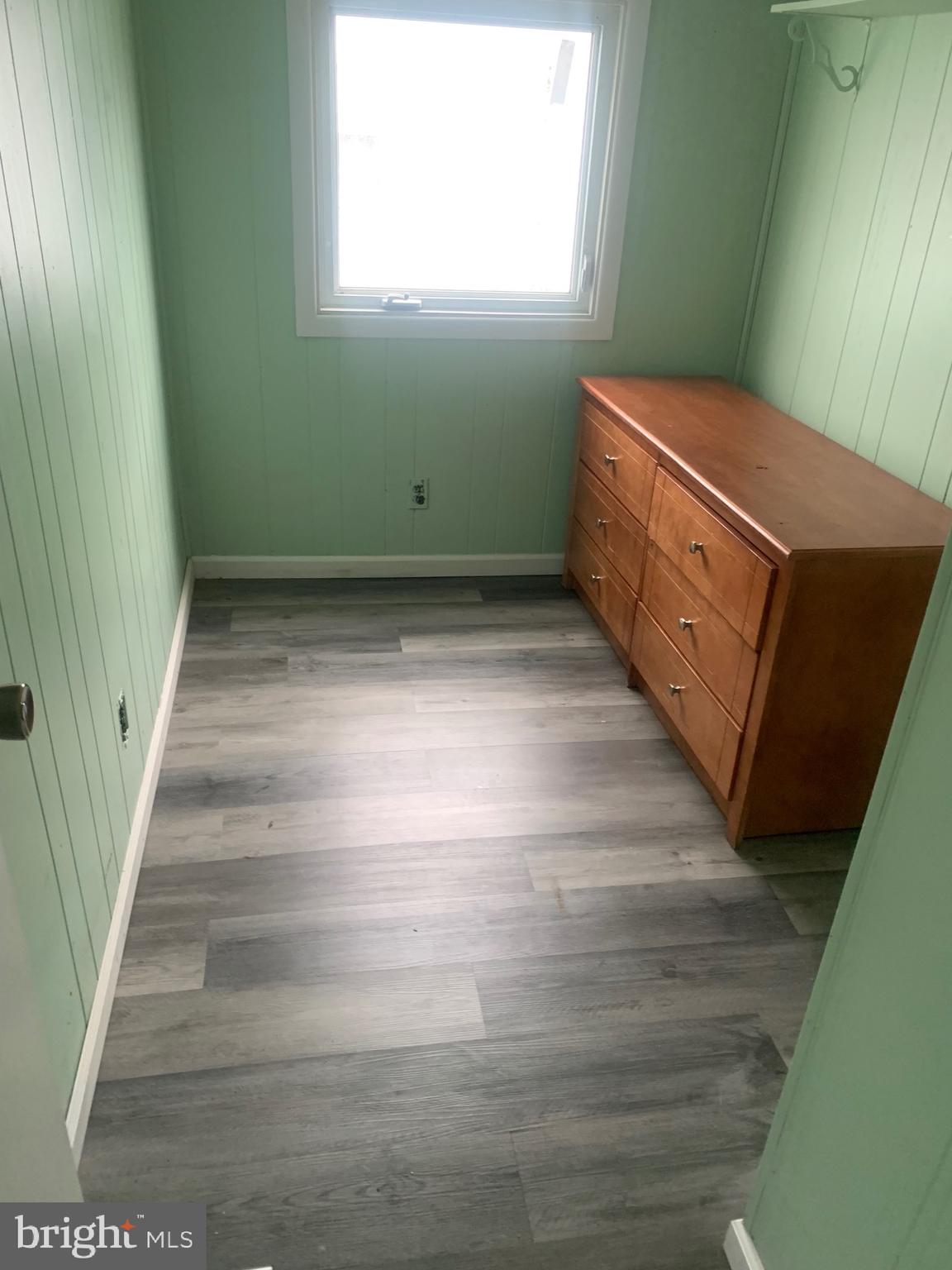 13318 Colonial Road Ocean City, MD 21842 - Photo 10 of 13 a view of room with window and stairs