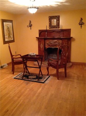 8 Patriot Road Stoneham, MA 02180 - Photo 3 of 22 a living room with furniture a flat screen tv and a table
