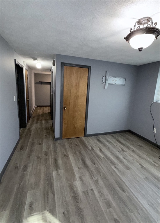 43 Haith Street, Unit B Revere, MA 02151 - Photo 6 of 9 a view of empty room with wooden floor