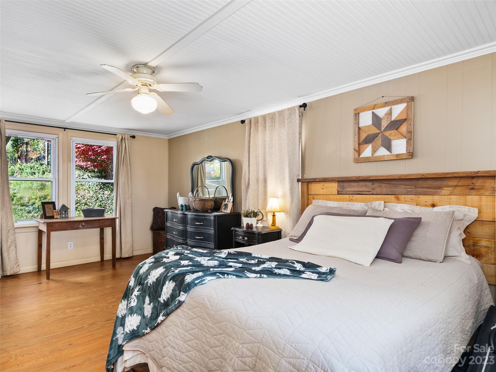 329 Star Ridge Road Canton, NC 28716 - Photo 16 of 37 a bedroom with a large bed and a window
