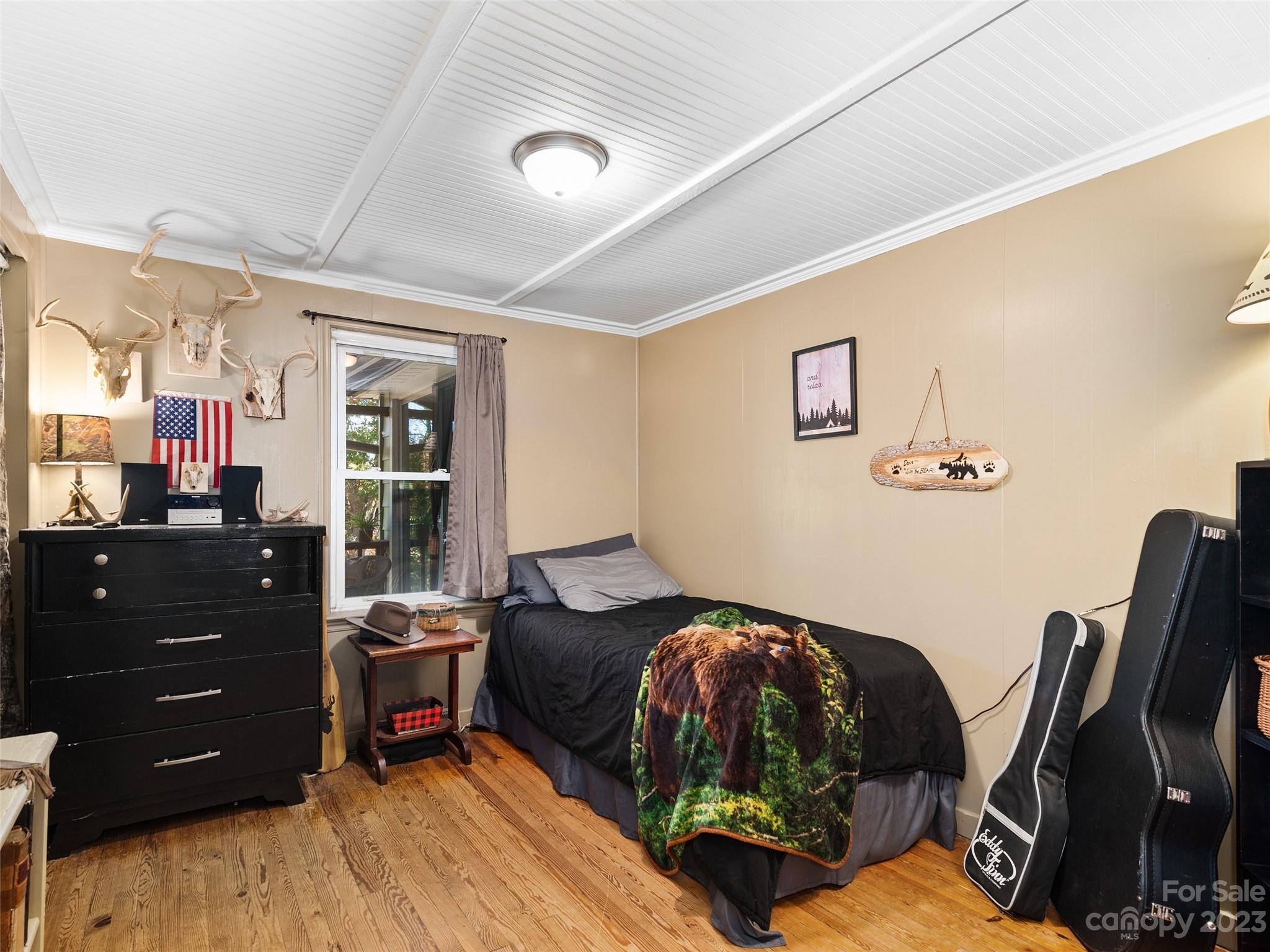 329 Star Ridge Road Canton, NC 28716 - Photo 19 of 37 a bedroom with a bed and furniture
