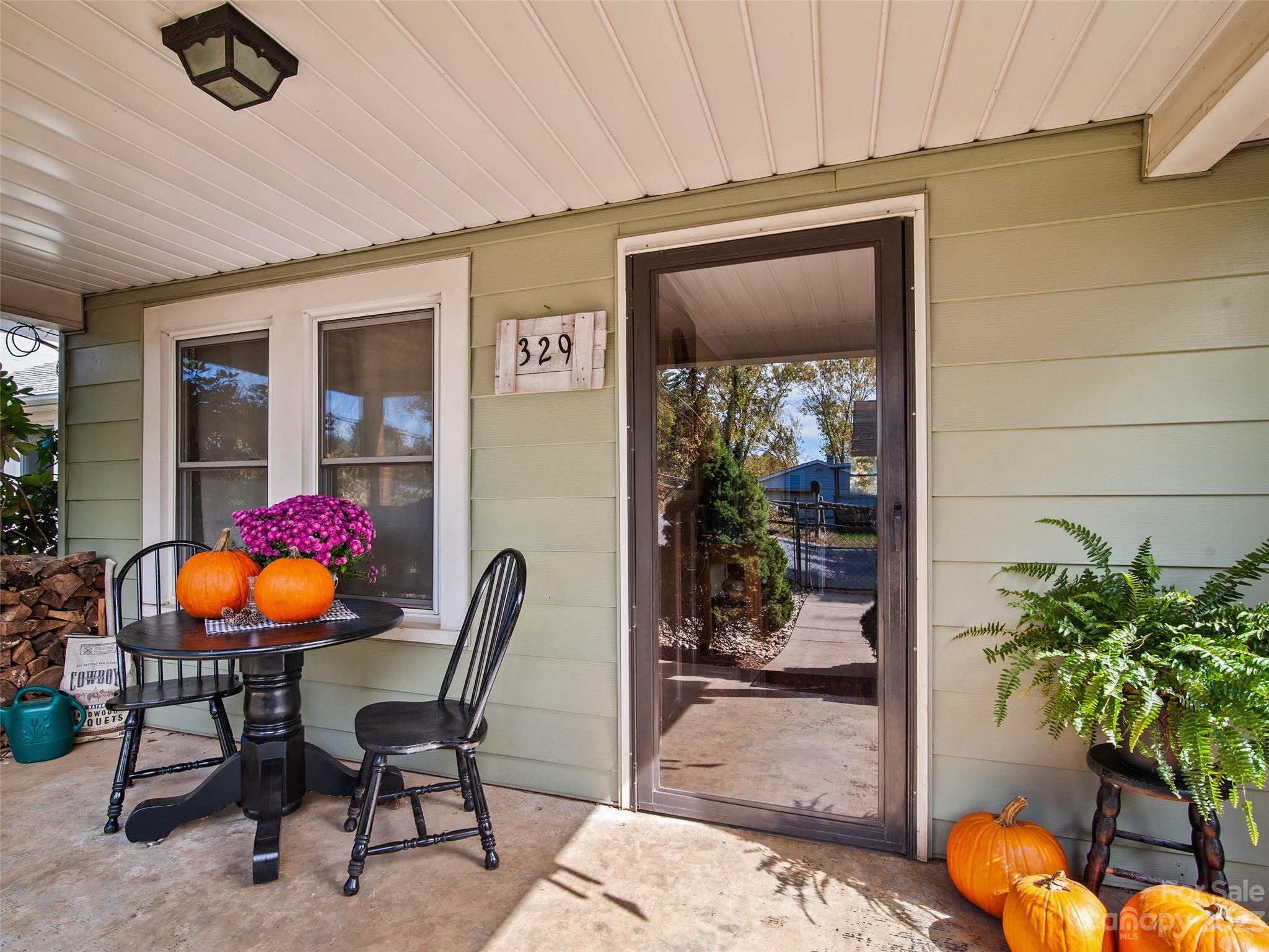 329 Star Ridge Road Canton, NC 28716 - Photo 6 of 37 a outdoor space with chairs and potted plant