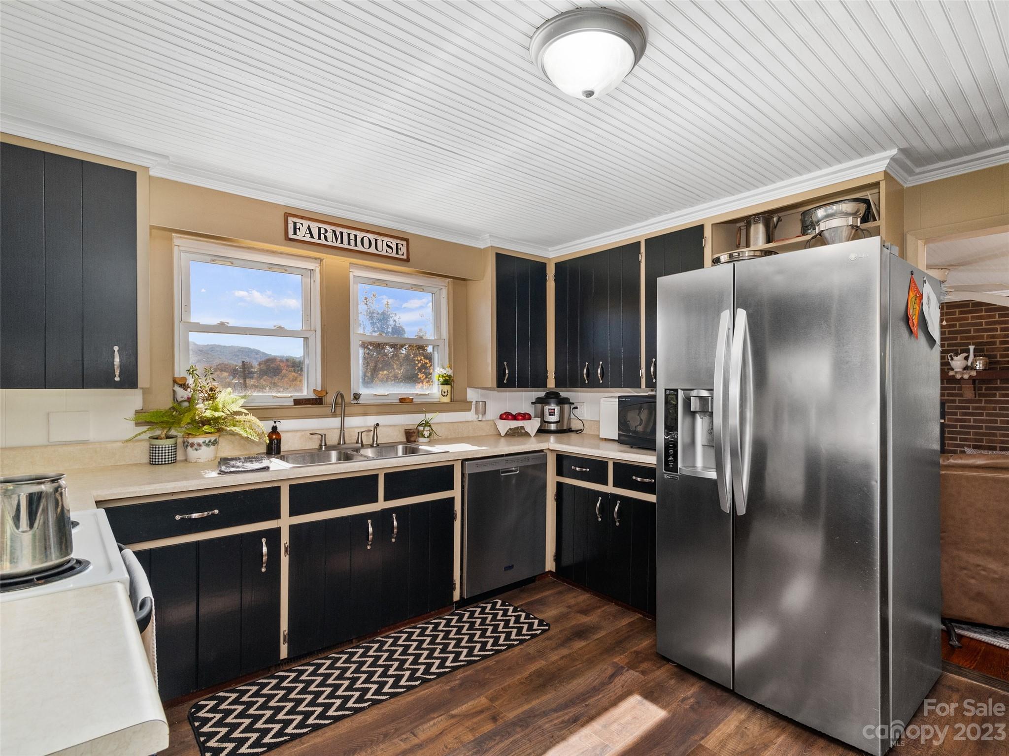329 Star Ridge Road Canton, NC 28716 - Photo 10 of 37 a kitchen with a sink stainless steel appliances and cabinets