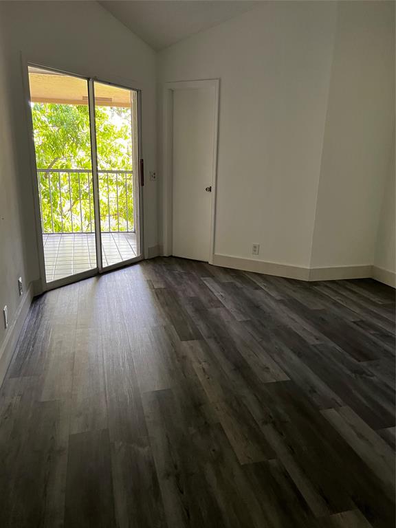 6596 Via Regina, Unit 6596 Boca Raton, FL 33433 - Photo 6 of 16 a view of a livingroom with wooden floor and window