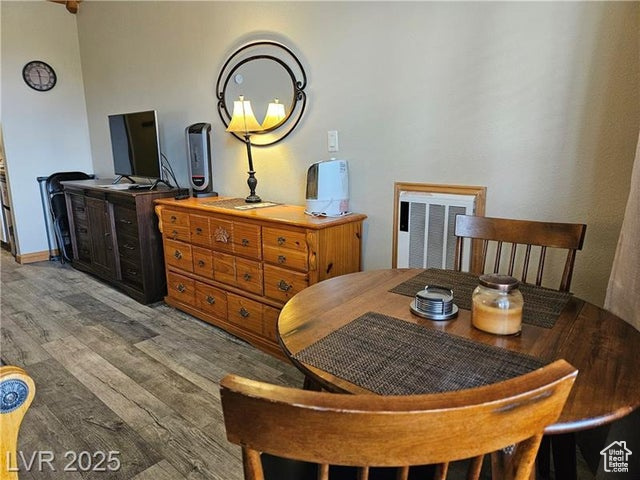 223 Hunter Ridge Drive, Unit E121 Brian Head, UT 84719 - Photo 12 of 35 Dining area featuring wood finished floors