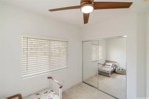 a view of a livingroom with a lounge chair and chandelier
