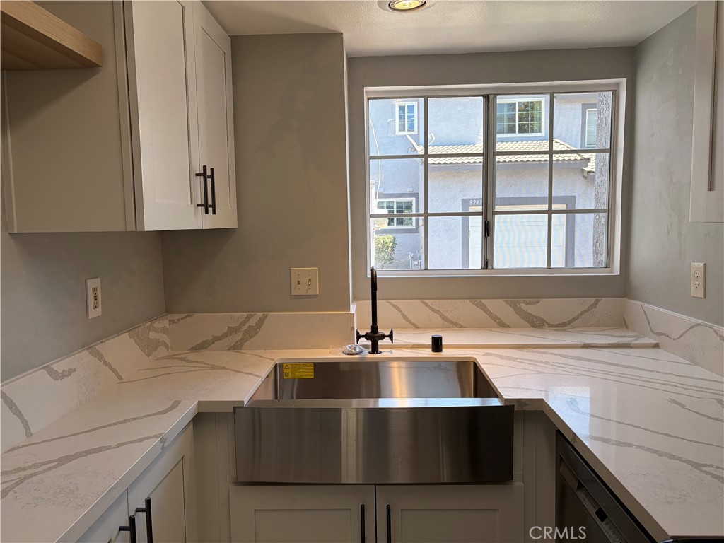 8248 Inglenook Place Rancho Cucamonga, CA 91730 - Photo 2 of 12 a kitchen with a sink and a window