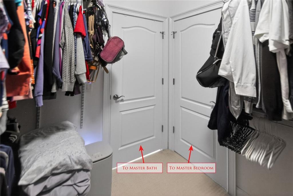 4113 Ledan Extension Gainesville, GA 30506 - Photo 117 of 195 a view of walk in closet with clothes and shoes