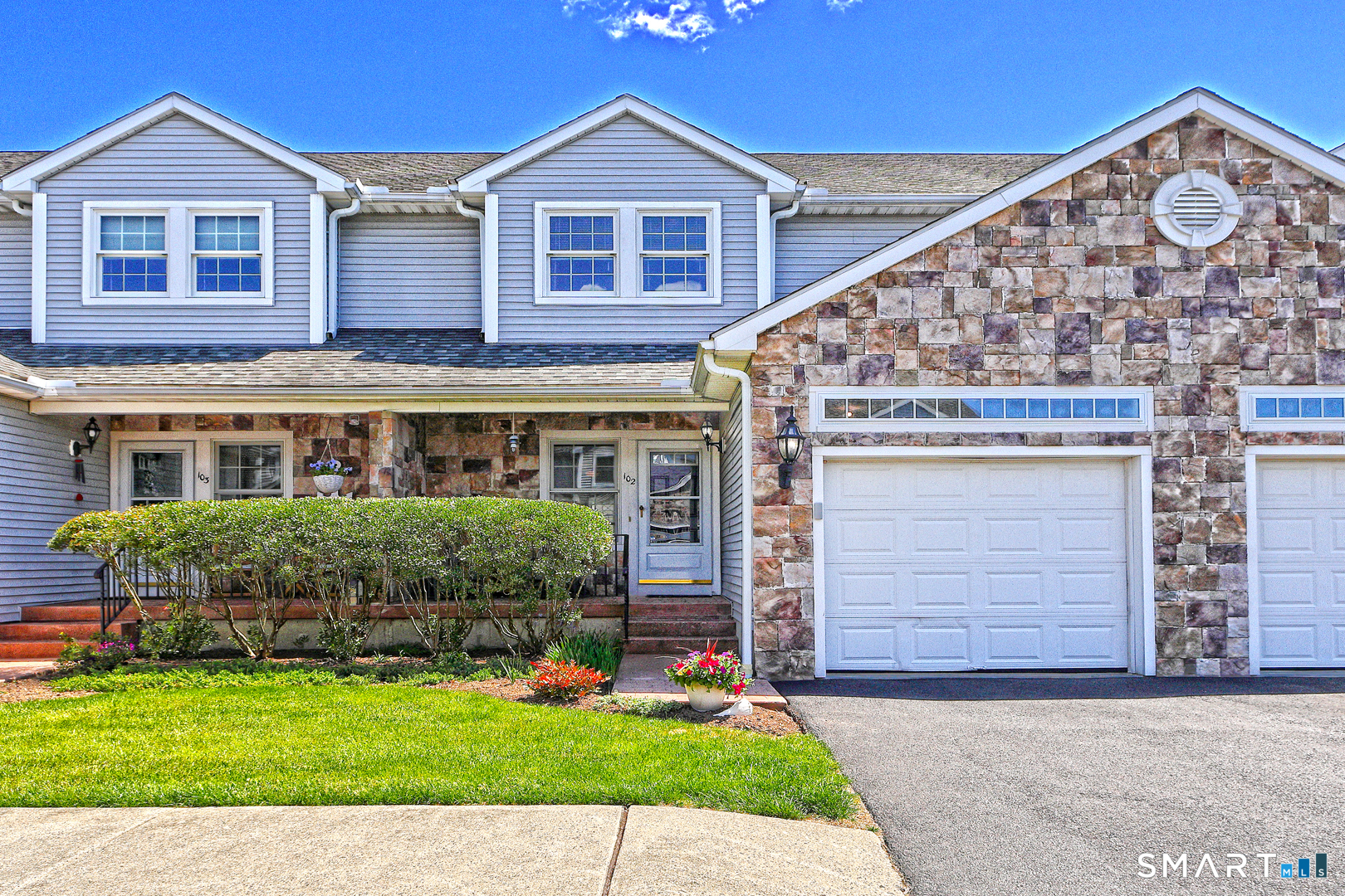 102 Lantern Court, Unit 102 Clinton, CT 06413 - Photo 1 of 36 a front view of a house with garden