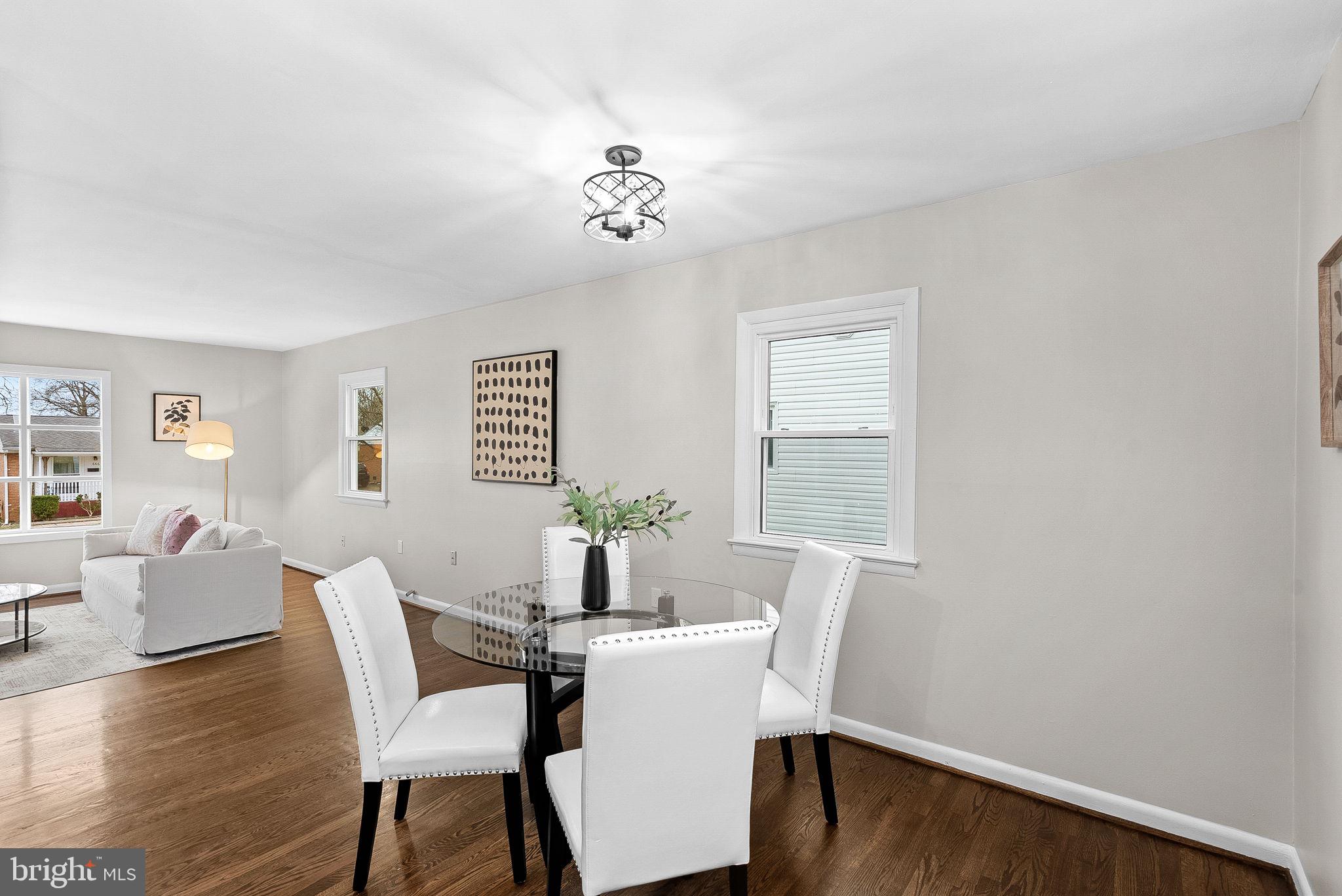 647 Battle Avenue Winchester, VA 22601 - Photo 11 of 44 a view of a dining room with furniture wooden floor and a chandelier