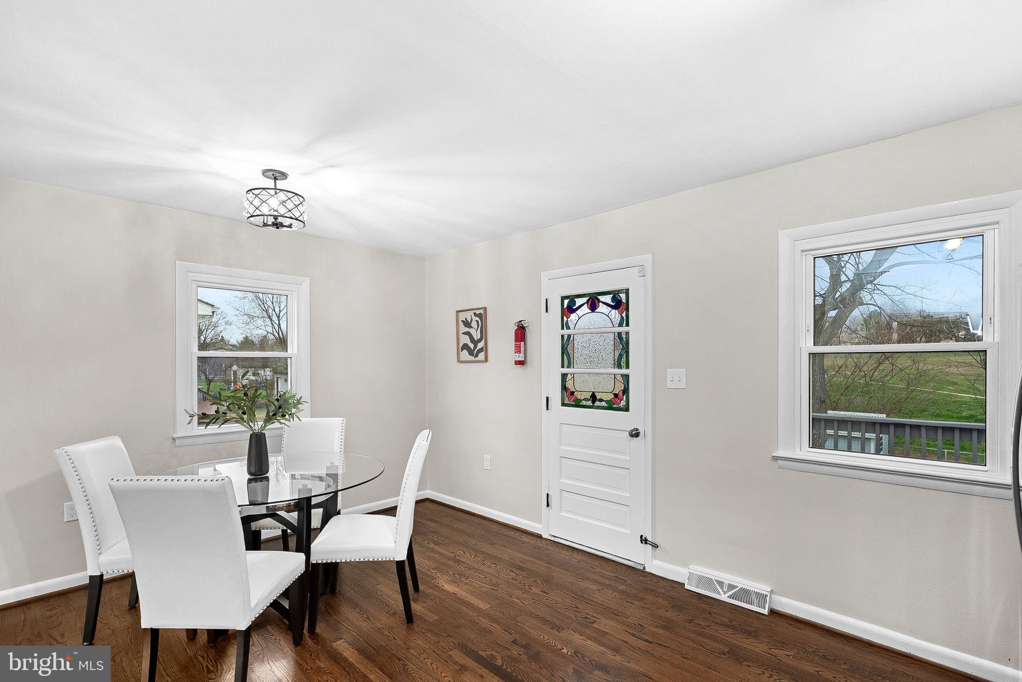 647 Battle Avenue Winchester, VA 22601 - Photo 12 of 44 a view of a dining room with furniture window and wooden floor