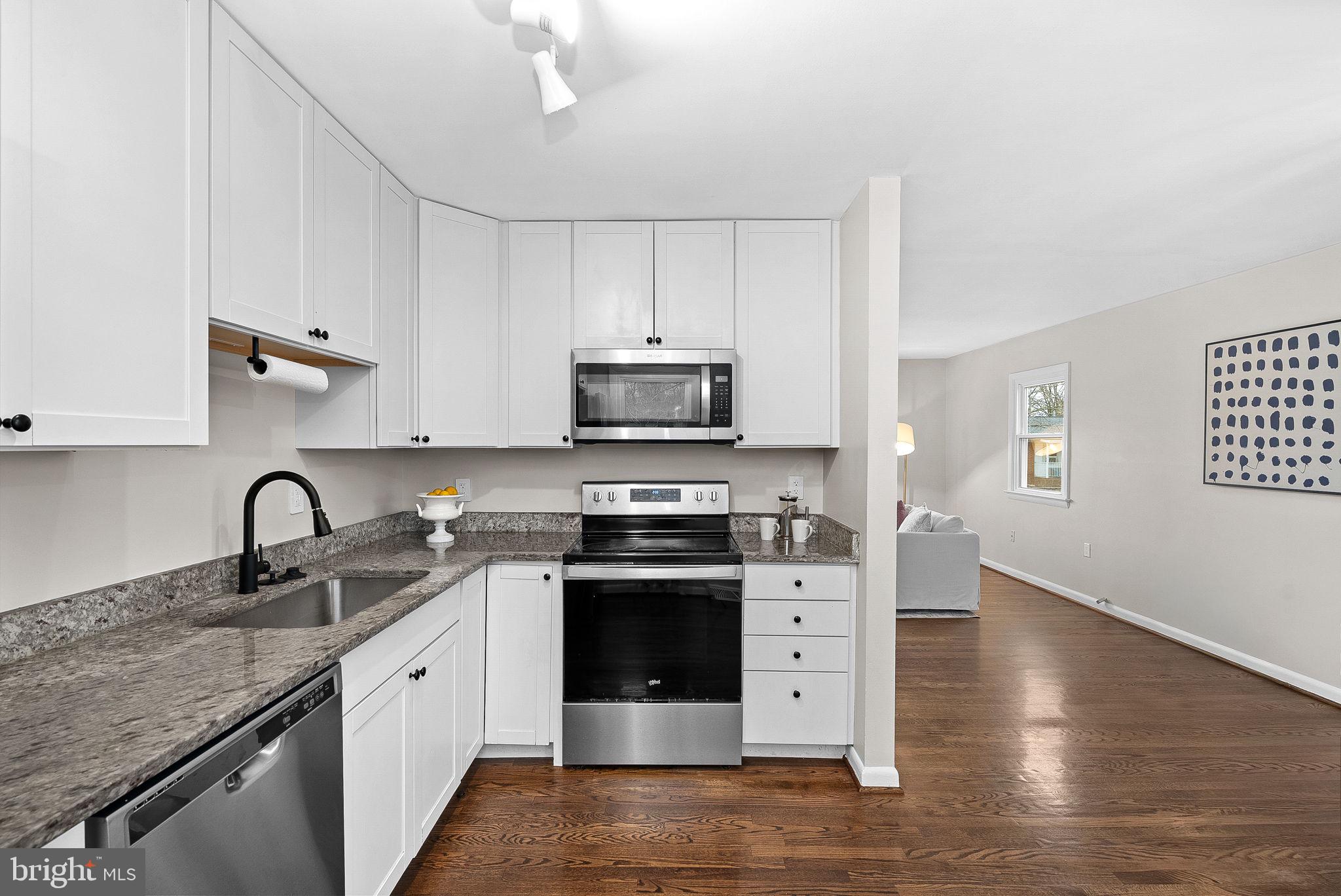 647 Battle Avenue Winchester, VA 22601 - Photo 16 of 44 a kitchen with stainless steel appliances granite countertop a stove sink and cabinets