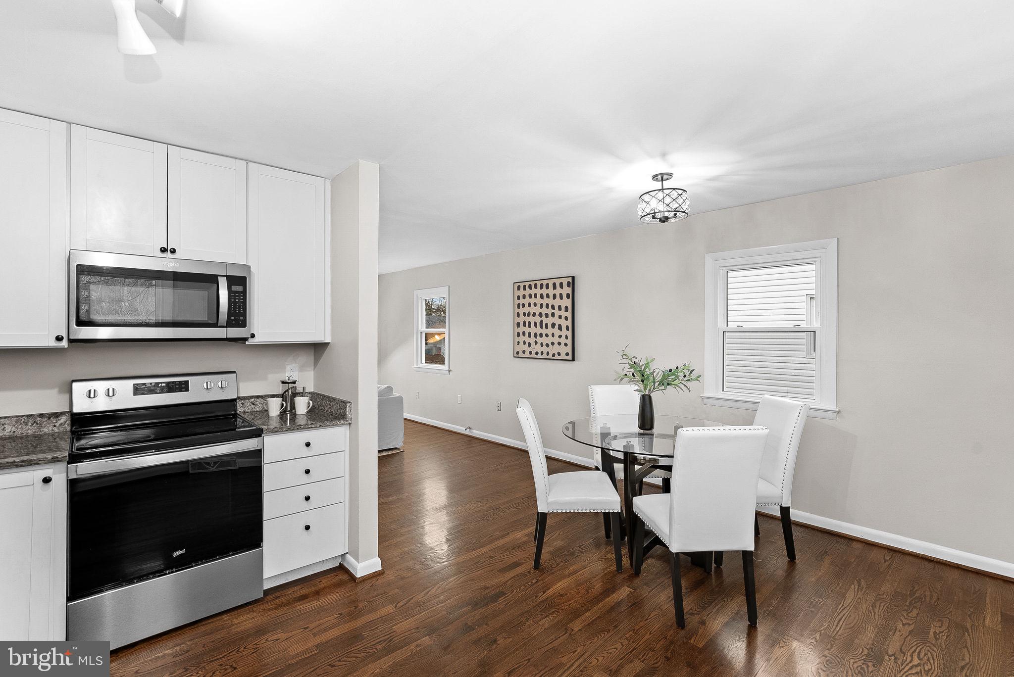 647 Battle Avenue Winchester, VA 22601 - Photo 19 of 44 a view of a dining room with furniture and wooden floor