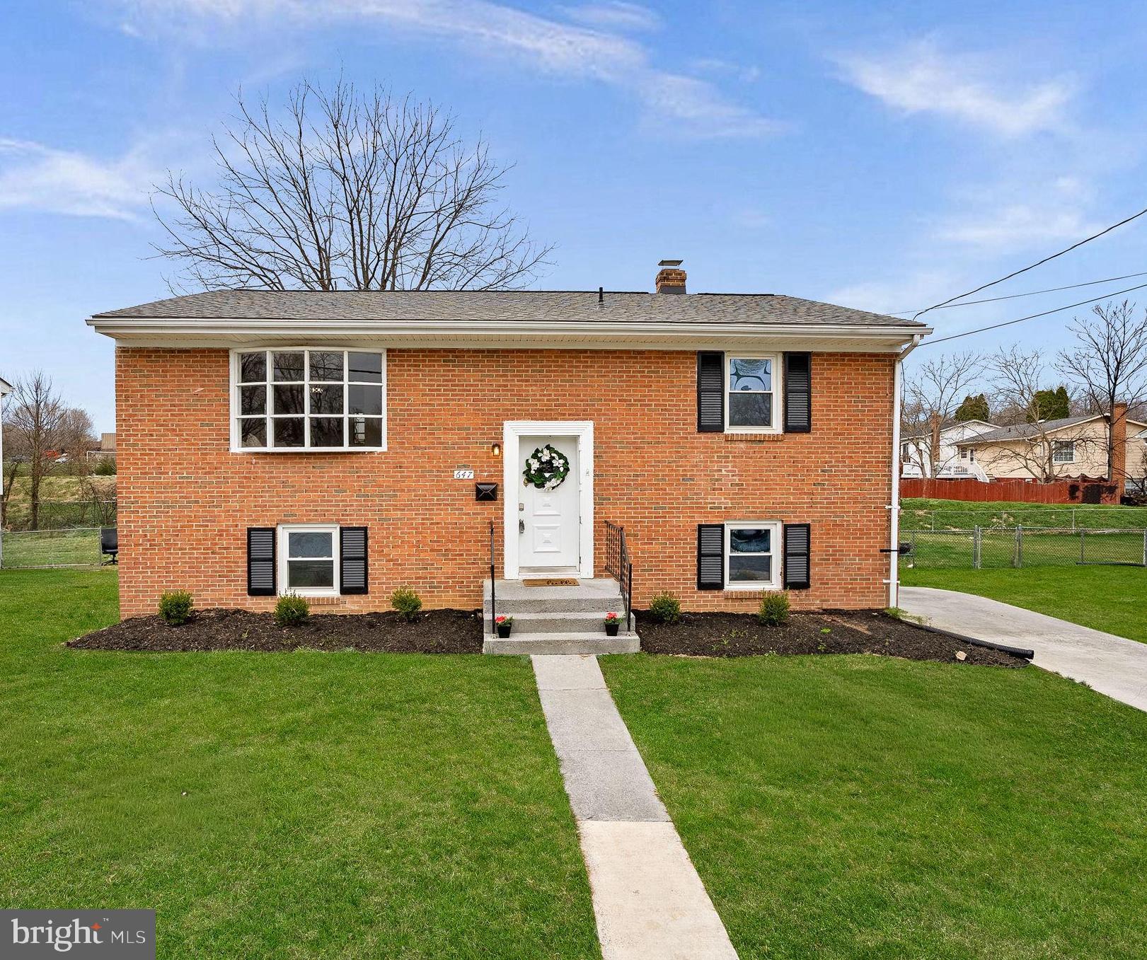 647 Battle Avenue Winchester, VA 22601 - Photo 2 of 44 a front view of a house with a yard