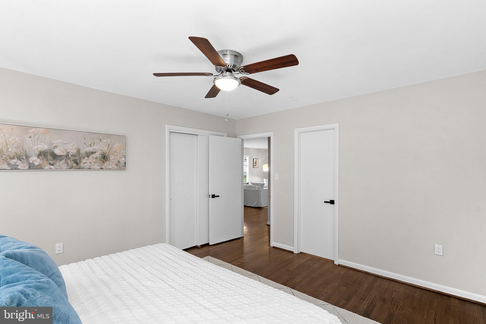 647 Battle Avenue Winchester, VA 22601 - Photo 22 of 44 a bedroom with a large bed and a chandelier fan