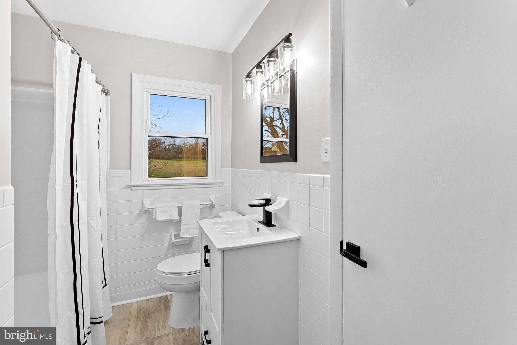 647 Battle Avenue Winchester, VA 22601 - Photo 23 of 44 a bathroom with a sink toilet and shower